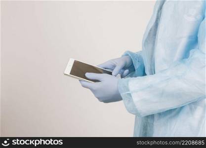 surgeon s hands working with tablet