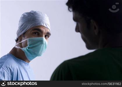 Surgeon talking to a patient
