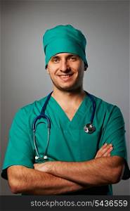 Surgeon with stethoscope over grey background