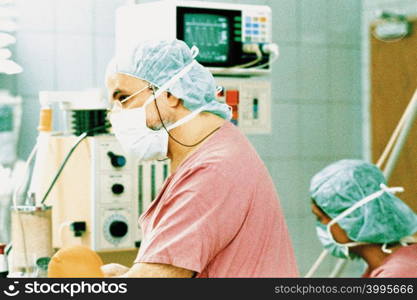 Surgeons in operating theatre