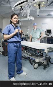 Surgeons in operating theatre