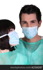 Surgeons wearing face masks