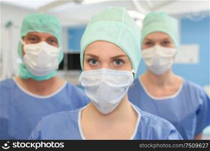 surgeons wearing protective mask and cup ready for operation