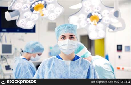 surgery, medicine and people concept - surgeon in operating room at hospital. surgeon in operating room at hospital