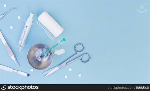 surgical equipment s syringe glass pills gauze roll blue background. Resolution and high quality beautiful photo. surgical equipment s syringe glass pills gauze roll blue background. High quality and resolution beautiful photo concept