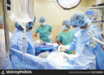 Surgical Team Working In Operating Theatre