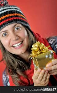 Surpised young woman with Christmas present box