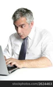 surprise gesture senior businessman working laptop computer white desk