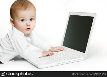Surprised baby using a laptop computer