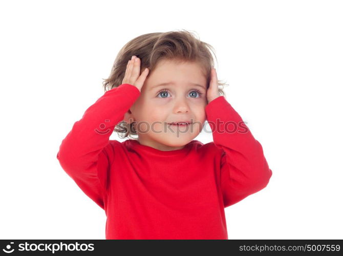 Surprised baby with his hands on the head isolated on a white background