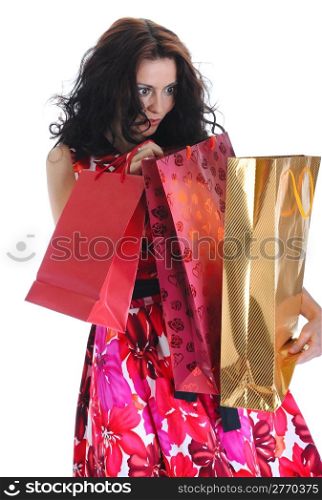 Surprised beautiful girl with the package. Isolated on white background