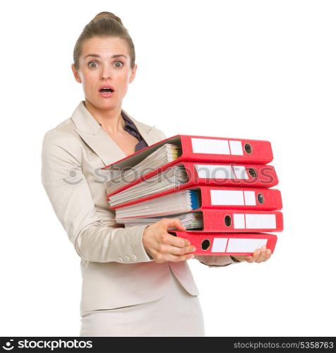 Surprised business woman holding stack of folders