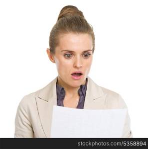 Surprised business woman reading document