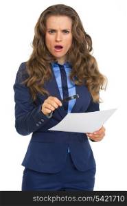Surprised business woman with magnifying glass and document