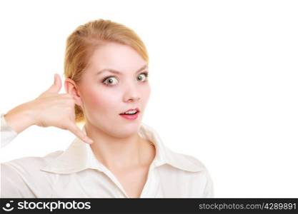 Surprised businesswoman making call me gesture. Shocked girl with phone hand sign. Business communication. Isolated on white.