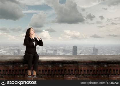 Surprised businesswoman. Young emotional businesswoman covering mouth with palm