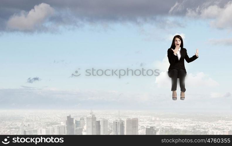 Surprised businesswoman. Young emotional businesswoman covering mouth with palm