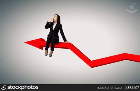 Surprised businesswoman. Young emotional businesswoman sitting on increasing graph