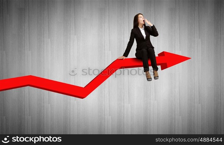 Surprised businesswoman. Young emotional businesswoman sitting on increasing graph