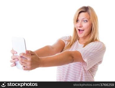 Surprised emotional young woman using tablet touchpad. Blond shocked girl reading e-book e-reader isolated. Technology.