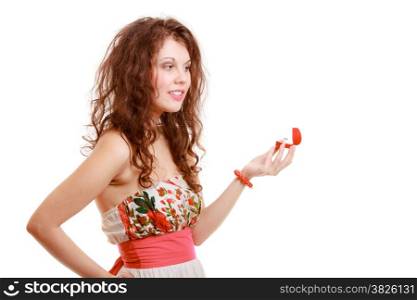Surprised girl holding red heart shaped box with engagement ring. Young woman with valentine present. Isolated. Studio shot.