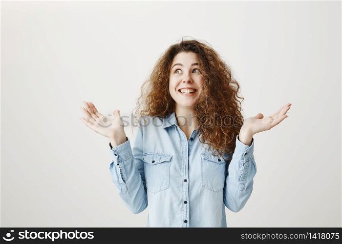 Surprised happy beautiful woman looking excitement. Isolated on gray background.. Surprised happy beautiful woman looking excitement. Isolated on gray background