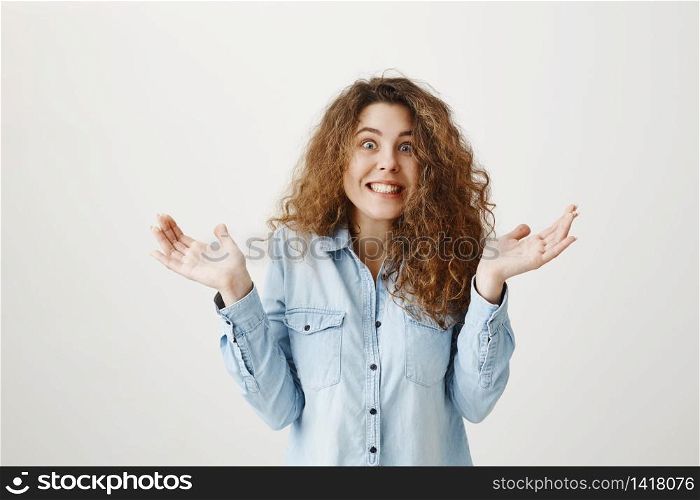 Surprised happy beautiful woman looking excitement. Isolated on gray background.. Surprised happy beautiful woman looking excitement. Isolated on gray background