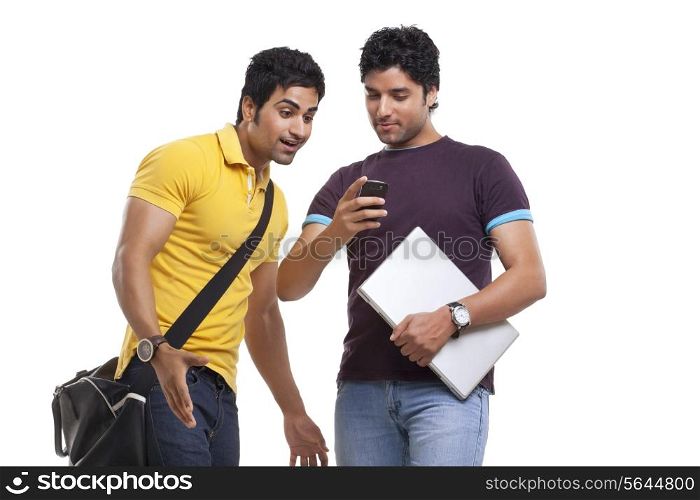 Surprised man looking at friend&rsquo;s cell phone