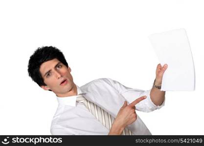 Surprised man showing a document