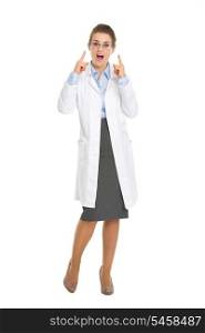 Surprised oculist doctor woman pointing on eyeglasses