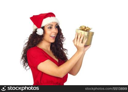 Surprised pretty woman in Christmas with a gift isolated on white background