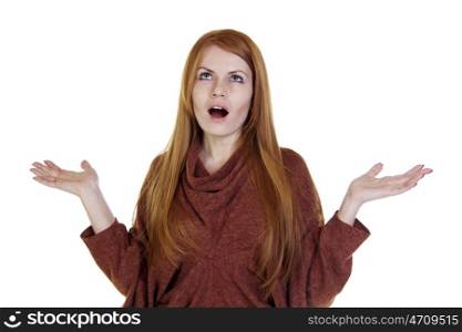 Surprised red-haired young woman with arms raised up, isolated on white background