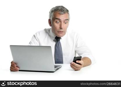 surprised senior businessman expression gesture mobile phone laptop gray hair