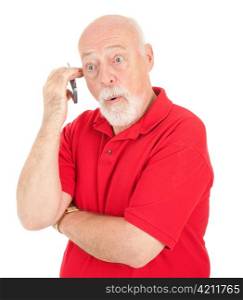 Surprised senior man talking on his cell phone. Isolated on white.
