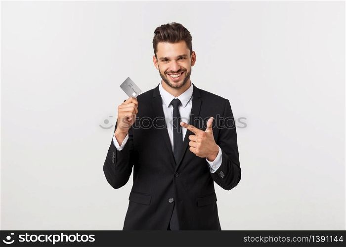 Surprised, speechless and impressed handsome caucasian businessman in classic suit showing credit card, say wow, standing white background astonished.. Surprised, speechless and impressed handsome caucasian businessman in classic suit showing credit card, say wow, standing white background astonished