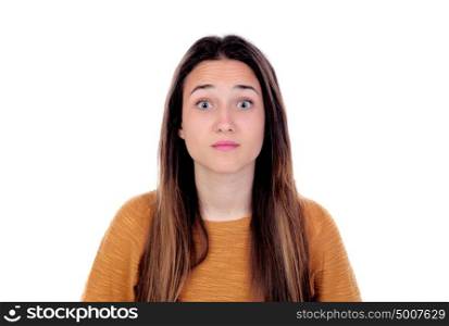 Surprised teenager girl with yellow jersey isolated on a white background