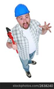 Surprised tradesman holding a pipe wrench