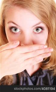 surprised woman afraid buisnesswoman covers mouth with hand. Confidential information.