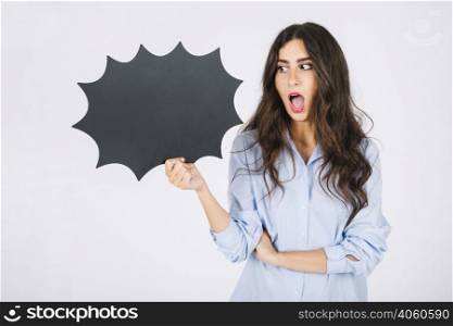surprised woman presenting speech bubble slate