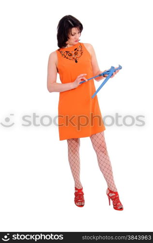 surprised woman with wrench isolated on white background