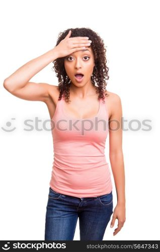 Surprised young african woman over white background