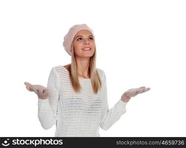 Surprised young caucasian woman in warm clothing in studio isolated on white smiling