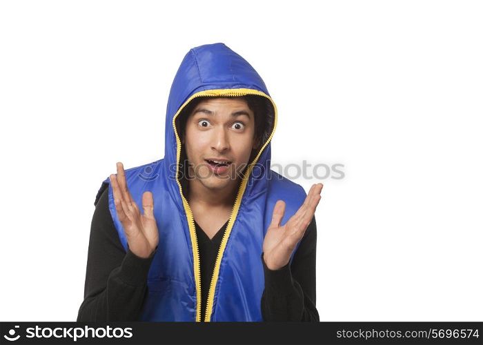 Surprised young man over white background