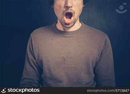 Surprised young man with his mouth open