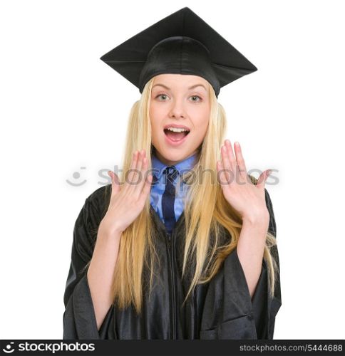Surprised young woman in graduation gown
