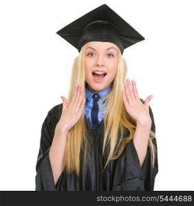 Surprised young woman in graduation gown