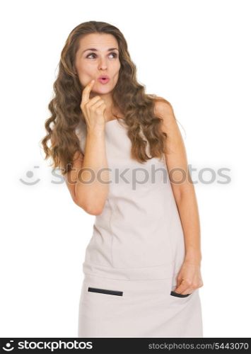Surprised young woman looking on copy space
