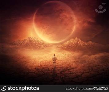 Surreal background as a young boy walks on another planet with dry and cracked ground, following a shining space object in the sky.
