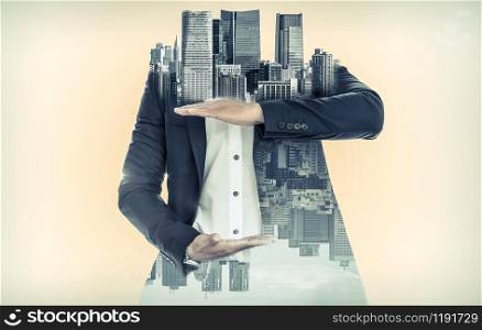 Surreal businessman open hand for your text - Businessman opening palms making hand gestures to build copy space for your business text or logo with modern city in background.. Surreal businessman open hand for your text.
