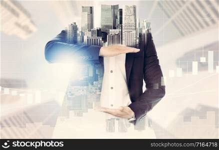 Surreal businessman open hand for your text - Businessman opening palms making hand gestures to build copy space for your business text or logo with modern city in background.. Surreal businessman open hand for your text.
